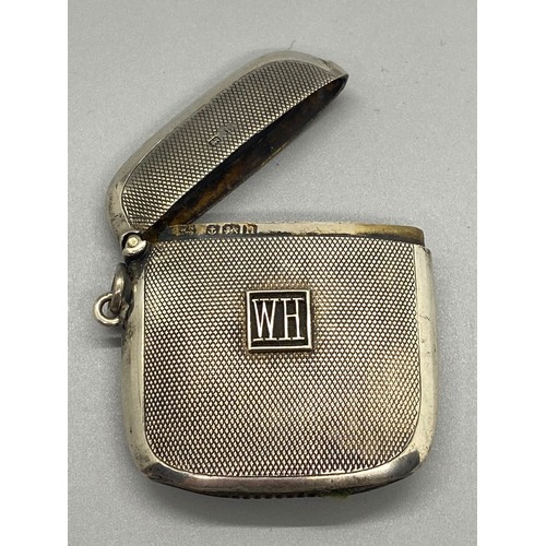 90 - silver hallmarked vesta case with  WH emblem on the front