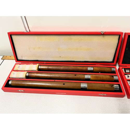 36 - 7 wooden frulas/flutes in 2 hard back cases.