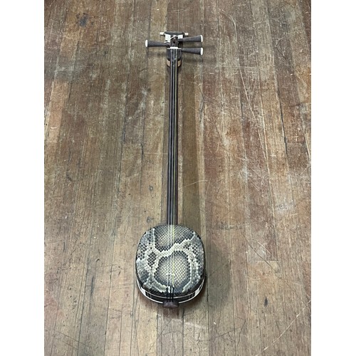 278 - Chinese Sanxian string instrument. Mahogany and snake skin.