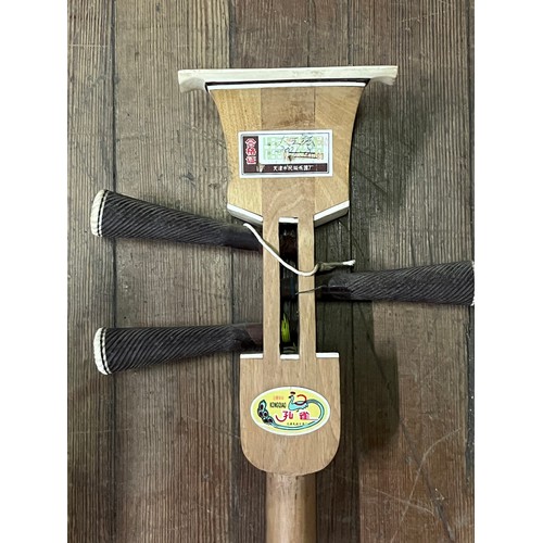 278 - Chinese Sanxian string instrument. Mahogany and snake skin.