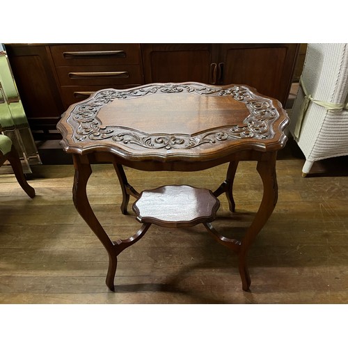 32 - Carved mahogany occasional table.