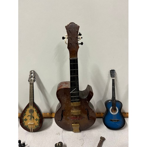 31 - Selection of miniature instruments to include musical & Guinness etc.