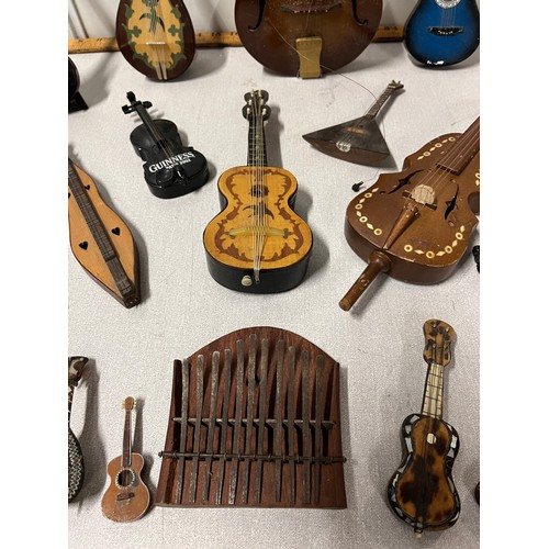 31 - Selection of miniature instruments to include musical & Guinness etc.