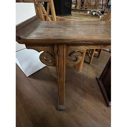 71 - Oriental wooden hall table with scroll design.