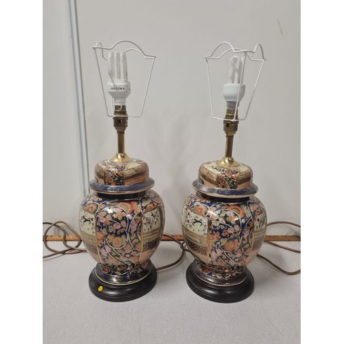 122 - 2 large oriental table lamps with shades.