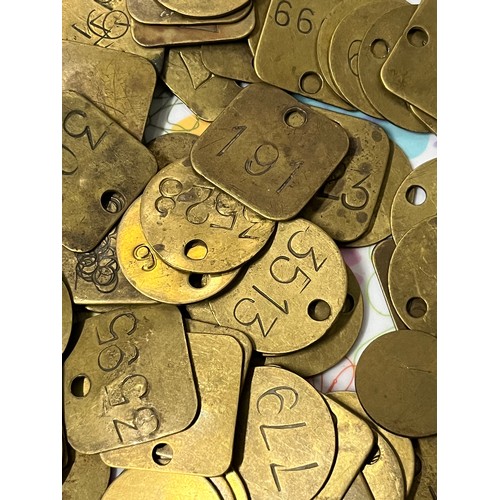 106 - Job lot of brass miners tally tokens