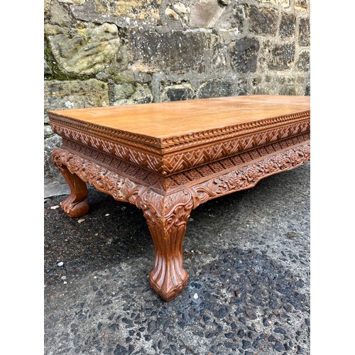 229 - Highly carved Chinese coffee table.