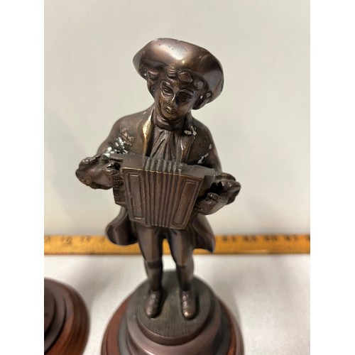 237 - Pair of bronze figurines to include Gentleman playing accordion & lady with basket.