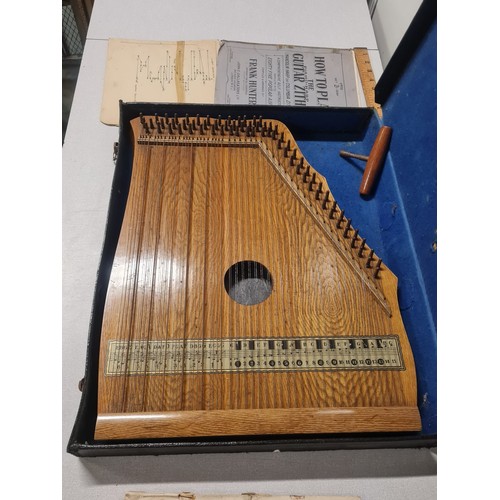 212 - Vintage piano harp with hard case & music sheets.