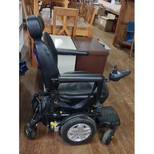 319 - Jazzy  600 ES mobility powerchair along with battery charger, instruction manual & 2 rain jackets th... 