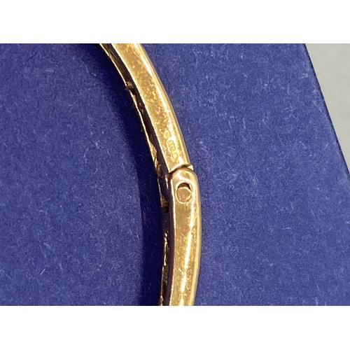 34 - 9ct gold bangle set with 9 diamonds 12.7g