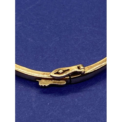 34 - 9ct gold bangle set with 9 diamonds 12.7g