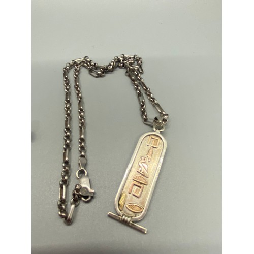 164 - silver chain with Egyptian pendent along with silver cross and chain