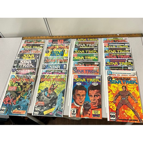 67 - 29 DC Star Trek comics in protective covers.