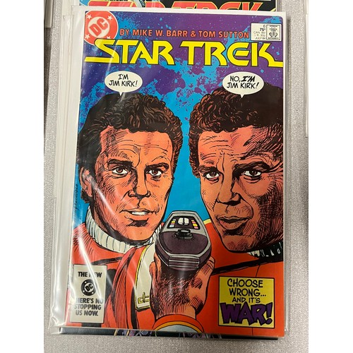 67 - 29 DC Star Trek comics in protective covers.