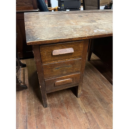 123 - Antique oak teacher/military desk with 6 drawers.