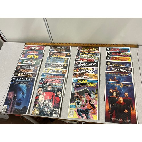 127 - 28 DC Star Trek comics in protective covers.