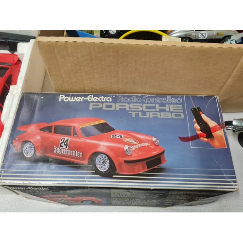 334 - Selection of vintage cars to include Power-Electra radio controlled Porsche turbo, Polistil, matchbo... 