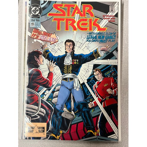 181 - 29 DC Star Trek Comics in protective covers.