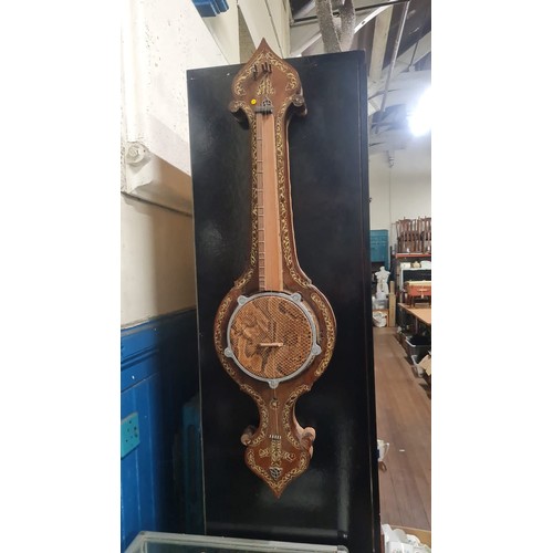 213 - Hand made banjo made from a barometer.
97cm l