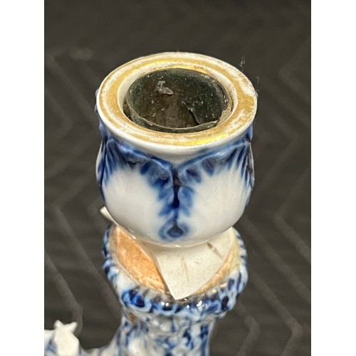 87 - 18th Century Meissen porcelain figural candlestick.
small pieces of damage
31cm h