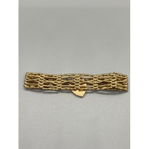 157 - 9ct gold gate bracelet
15.8g