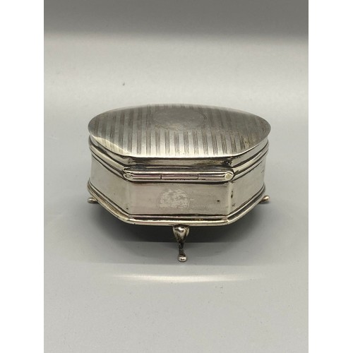 216 - S & Co Hallmarked silver jewellery/trinket box on legs with velvet lining. 56.25g