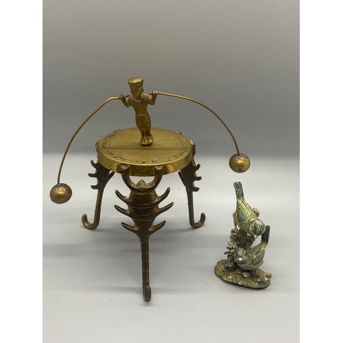 220 - Indian brass stand with balancing dancer along with small metal bird ornament.
tallest 14cm