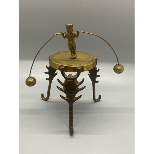 220 - Indian brass stand with balancing dancer along with small metal bird ornament.
tallest 14cm