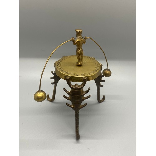 220 - Indian brass stand with balancing dancer along with small metal bird ornament.
tallest 14cm