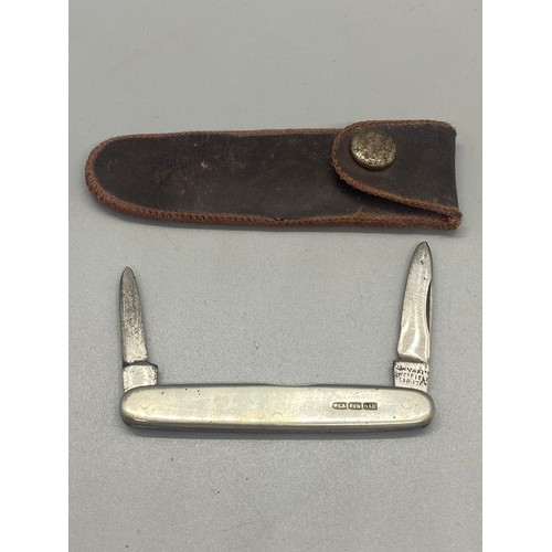 223 - Hallmarked silver John Watts pocket knife in leather sheath. 13.60g