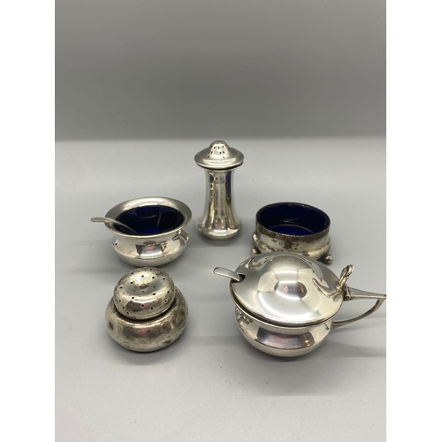 28 - Collection of vintage hallmarked silver cruets and salts etc with 2 spoons and 3 blue glass inserts.... 