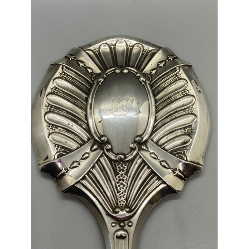 31 - Antique hallmarked silver Art Nouveau hand mirror.