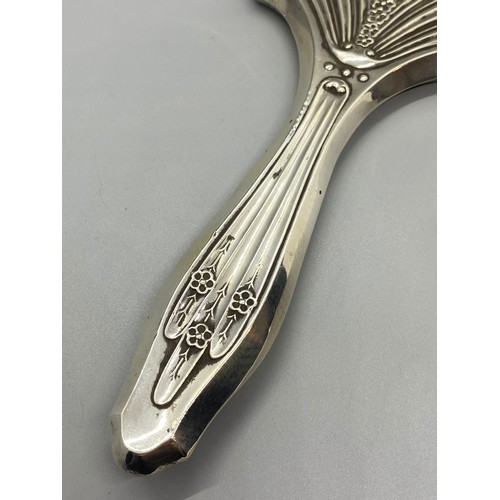 31 - Antique hallmarked silver Art Nouveau hand mirror.