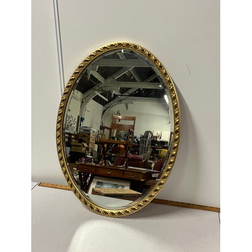 257 - Vintage gilt framed oval wall mirror.
73cm l