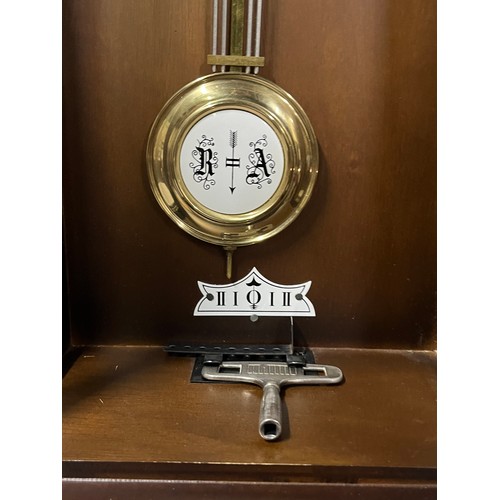 261 - Vintage mahogany wall clock with key.
84cm l