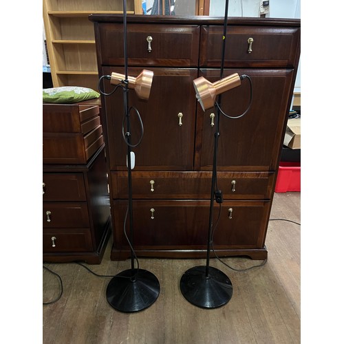 57 - Pair of retro floor standing spot lights with copper shades.