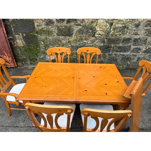 318 - Pine extending dining table with six matching chairs.