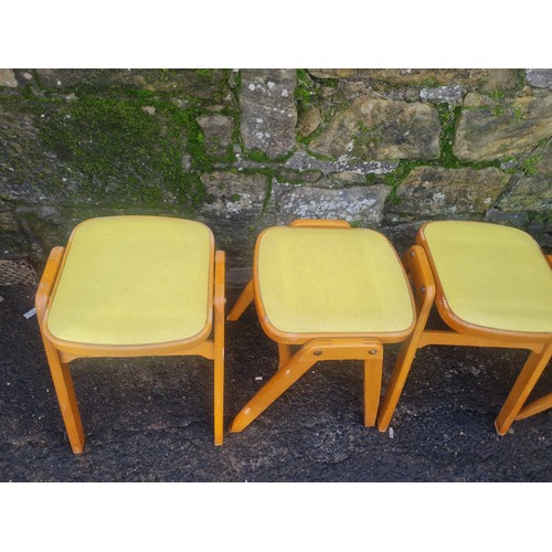 60 - 4 Mid Century stacking stools with lime green vinyl seat.