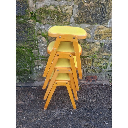 60 - 4 Mid Century stacking stools with lime green vinyl seat.