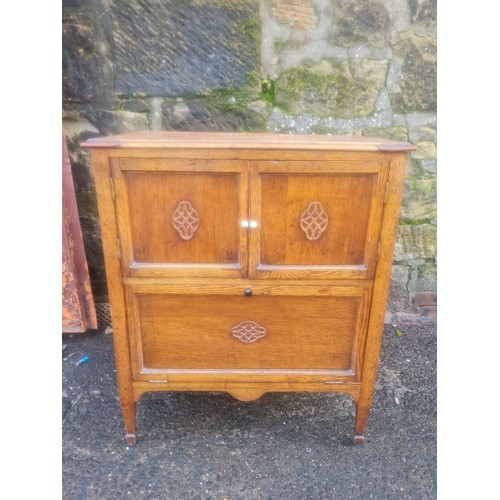 61 - Georgian oak nightstand with carving.