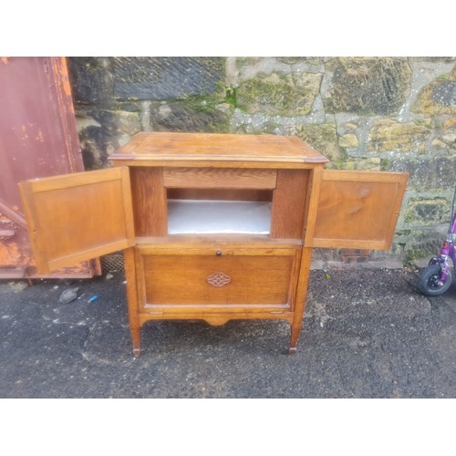 61 - Georgian oak nightstand with carving.