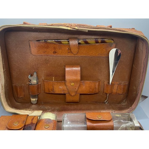 103 - Vintage silver fitted leather traveling vanity case with hallmarked silver lids and brushes by G.C. ... 