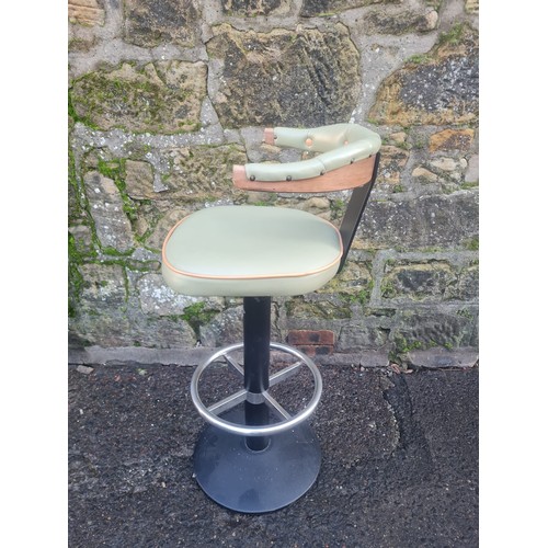 98 - Retro style swivel bar stool with green vinyl upholstery.