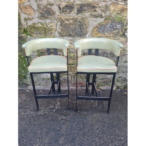 106 - Pair of green vinyl upholstered kitchen/bar stools.