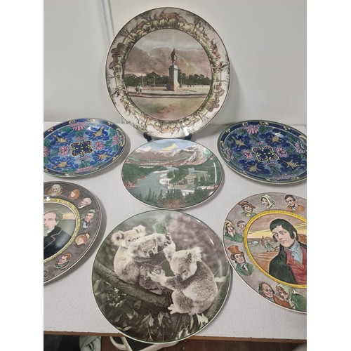 375 - Collection of 11 Royal Doulton decorative plates.