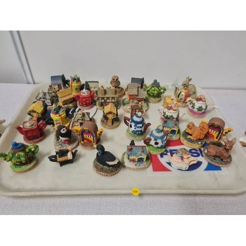 263 - Collection of Tetley figures and miniature teapots etc.