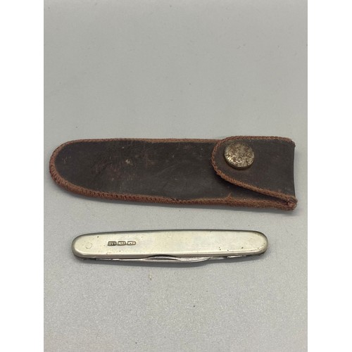 223 - Hallmarked silver John Watts pocket knife in leather sheath. 13.60g