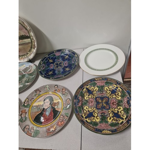 375 - Collection of 11 Royal Doulton decorative plates.