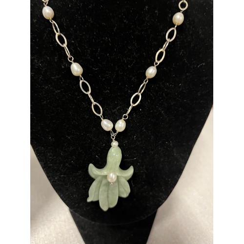 152 - Silver and jade carved orchid pendant & pearl necklace along with jade & pearl necklace with silver ... 